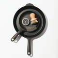 Overhead of the Daily Duo Set: two Field Skillets with pot brush, chain mail scrubber, and seasoning oil tin thumbnail